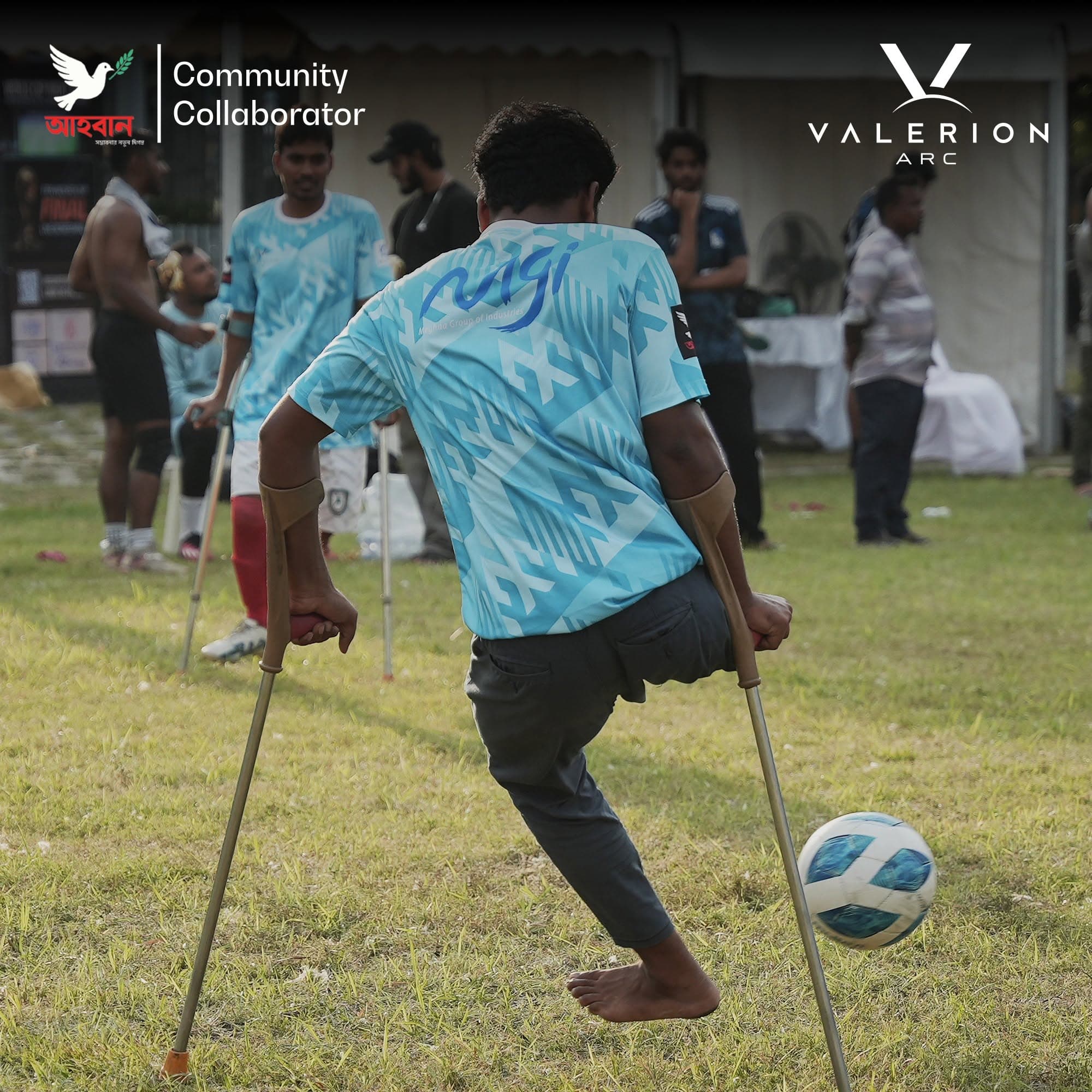 A Special Community Match player in a custom jersey produced by Zentra advancing with the ball on crutches